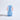 Blue vase with orange handles on a light gray background